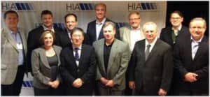 HIA Board Members include Jeff Newnham (Phonak), Rodney Schutt (Widex), Gordon Walker (Knowles Electronics), Todd Murray (GN ReSound), Peer Lauritsen (Oticon), Scott Davis (Siemens); Front Row L-R: Carole Rogin (HIA president), Robert Tong (ON Semiconductor), Jeff Taylor (Sonion), Jerry Ruzicka (Starkey), and Kevin Kouba (Rayovac).