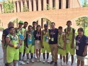 Audigy Group staff and Special Olympics basketball players.