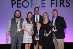 (L-R) 2017 Oticon Focus on People Award winners: John Cartwright (Advocacy); Ellie Kobak (Student); Oticon President Gary Rosenblum; Marilyn Hinrichs, AuD (Practitioner); Lieutenant Commander Michael McManus, and front, Braden Baker (Outstanding Achievement).