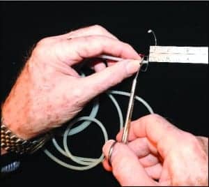 Figure 5. Cut a piece of 1/8-in od surgical tubing to the measured length (for narrower ear canals, you can use 3/16” od tubing).