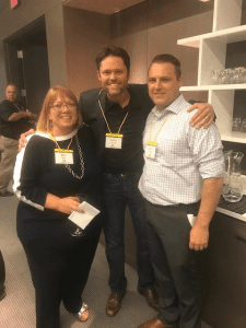 Justin Osmond of The Olive Osmond Foundation (center) takes a moment at the AUDNET Hearing Group Expo to visit with Deb Grant of AUDNET Hearing Group and Dr Lance Nelson of West Coast Hearing and Balance.