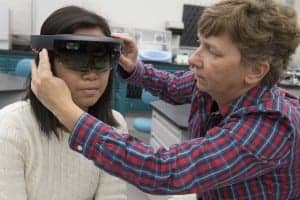 Anya Soberano, left, an electrical engineering technology major from St. Paul, Minn., works in the National Technical Institute for the Deaf’s Center on Access Technology Lab alongside Wendy Dannels, research associate professor and principal investigator on the augmented reality project.