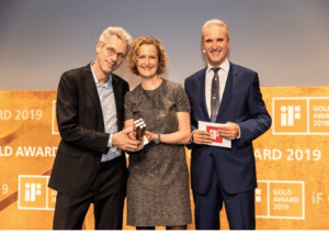 aarten Barmentlo, WS Audiology Chief Marketing Officer (l), and Christina Hakvoort, Head of Premium Segment, receiving the iF Gold Award 2019 for Styletto from Ralph Wiegmann, MD iF International Forum Design GmbH.