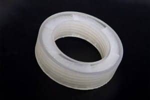The mathematically designed, 3D-printed acoustic metamaterial is shaped in such a way that it sends incoming sounds back to where they came from, Ghaffarivardavagh and Zhang say. Inside the outer ring, a helical pattern interferes with sounds, blocking them from transmitting through the open center while preserving air’s ability to flow through. Photo by Cydney Scott