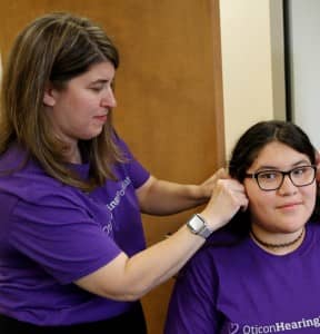 Oticon Audiologist Melinda Saban, AuD, joined with the FWISD audiologists to fit the students with the new hearing aids.