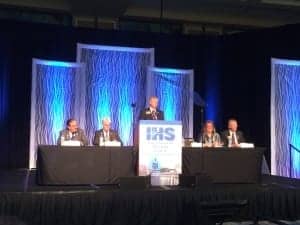 IHS President Scott Beall describes IHS's recent activities during the IHS Membership Meeting with (seated l to r) the Society's Secretary Antonio Calderon, MD, BC-HIS, President-elect Richard Giles, ACA, BC-HIS, Executive Director Kathleen Mennillo, and Treasurer Todd Beyer, ACA, BC-HIS.