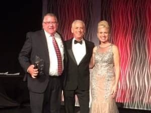 At the IHS Gala Dinner, Wayne Morris of the Oklahoma Hearing Assn was presented with the Society's James P. Lovell Award by Alan Lowell and Leanne Polhill.