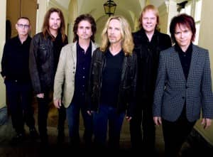 MACON, GA - OCTOBER 04: Rock Group STYX L/R: Chuck Panozzo, Ricky Phillips, Todd Sucherman, Tommy Shaw, James "J.Y." Young, and Lawrence Gowan. Portrait shoot at Macon City Auditorium on October 4, 2014 in Macon. (Photo by Rick Diamond/Getty Images for STYX)