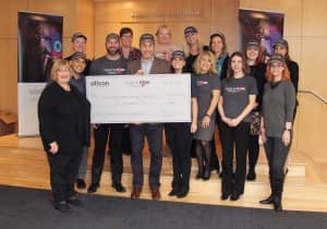 Oticon President Gary Rosenblum celebrates success of the 2018 Oticon “Hear in Pink” Campaign with the presentation of a $10,000 donation to National Breast Cancer Coalition representative Donna Duncan.