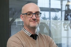 Matthew Dye, an assistant professor at RIT’s National Technical Institute for the Deaf, right, is working with a team of researchers to study how languages change over time. Credit: Mark Benjamin/NTID